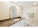 Bathroom boasts granite counters, vanity, and updated fixtures for a modern, elegant feel at 14300 Gulf Blvd # 401, Madeira Beach, FL 33708