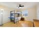 Bright, airy bedroom with bunk bed, window and ceiling fan at 14300 Gulf Blvd # 401, Madeira Beach, FL 33708