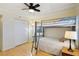 Bedroom with bunk bed, a ceiling fan, closet, and bright natural light at 14300 Gulf Blvd # 401, Madeira Beach, FL 33708