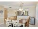 Inviting dining room featuring tile floors and a stylish light fixture at 14300 Gulf Blvd # 401, Madeira Beach, FL 33708