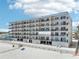 Beachfront condo building with private balconies, offering stunning ocean views at 14300 Gulf Blvd # 401, Madeira Beach, FL 33708