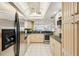 Modern kitchen with stainless steel appliances, granite countertops, and ample cabinet space at 14300 Gulf Blvd # 401, Madeira Beach, FL 33708