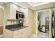 Bright kitchen area with granite countertops and light wood cabinets at 14300 Gulf Blvd # 401, Madeira Beach, FL 33708