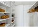Spacious walk-in closet features custom shelves and hanging rods for optimal organization at 14300 Gulf Blvd # 401, Madeira Beach, FL 33708
