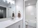 Bathroom features a white vanity and a stainless steel faucet at 14611 Pine Glen Cir, Lutz, FL 33559