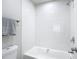 Bathroom with white tiled shower and tub combination at 14611 Pine Glen Cir, Lutz, FL 33559