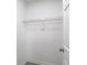 Walk-in closet with wire shelving, new paint, and wood-look floors at 14611 Pine Glen Cir, Lutz, FL 33559