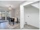 Dining room boasting new floors, stylish lighting, and access to the outdoor patio at 14611 Pine Glen Cir, Lutz, FL 33559