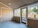 Enclosed sunroom has tile floors and large windows at 14611 Pine Glen Cir, Lutz, FL 33559