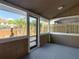 Enclosed sunroom with access to the backyard at 14611 Pine Glen Cir, Lutz, FL 33559
