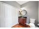 Bathroom with granite countertop, hardwood floors, vanity, and toilet at 14648 Bournemouth Rd, Tampa, FL 33626