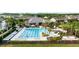 Inviting community pool area with ample seating and lush landscaping, perfect for relaxation at 14648 Bournemouth Rd, Tampa, FL 33626