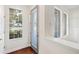 Bright entryway with wood floors, transom window and lake views at 14648 Bournemouth Rd, Tampa, FL 33626