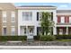 Charming two-story townhome featuring a well-manicured front yard and classic architectural details at 14648 Bournemouth Rd, Tampa, FL 33626