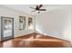 Bright living room featuring hardwood floors, neutral walls, and a ceiling fan at 14648 Bournemouth Rd, Tampa, FL 33626