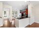 Inviting living room with wood floors and access to dining area with lake views at 14648 Bournemouth Rd, Tampa, FL 33626