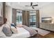 Tranquil primary bedroom with hardwood floors, neutral decor, and a sliding glass door at 14910 Tom Fazio Ct, Tampa, FL 33626