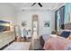 Primary bedroom with hardwood floors and views of the backyard at 14910 Tom Fazio Ct, Tampa, FL 33626