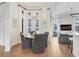 Open-concept dining area with ample natural light and views of the backyard at 14910 Tom Fazio Ct, Tampa, FL 33626