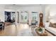 Welcoming foyer with hardwood floors, high ceilings, and views into the dining and living areas at 14910 Tom Fazio Ct, Tampa, FL 33626