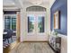 Welcoming foyer featuring double doors, elegant console table, and a view into the dining room at 14910 Tom Fazio Ct, Tampa, FL 33626