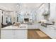 Modern kitchen featuring white cabinetry, stainless steel appliances, and an open design at 14910 Tom Fazio Ct, Tampa, FL 33626