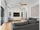 Spacious living room with coffered ceilings, a modern ceiling fan, and sliding glass doors to the pool area at 14910 Tom Fazio Ct, Tampa, FL 33626