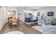 Open-concept living space connecting the dining area, kitchen, and living room at 14910 Tom Fazio Ct, Tampa, FL 33626