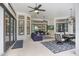 Spacious outdoor living area perfect for entertaining, with multiple seating areas and stylish decor at 14910 Tom Fazio Ct, Tampa, FL 33626