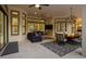 Luxurious outdoor living space with comfortable seating, dining area, and serene ambiance at 14910 Tom Fazio Ct, Tampa, FL 33626