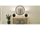 Stylish entryway featuring a console table with lamps, decorative accessories, and modern decor at 18473 Serene Lake Loop, Lutz, FL 33548