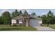 Charming single-Gathering home featuring stone accents, a well-manicured lawn, and an attached two-car garage at 18473 Serene Lake Loop, Lutz, FL 33548