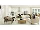 A cozy living space with an open-concept kitchen and stylish furniture at 18473 Serene Lake Loop, Lutz, FL 33548