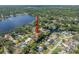 A stunning aerial view showcases waterfront homes with access to the lake at 18712 Lakeshore Dr, Lutz, FL 33549