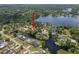 An aerial of a property with lush greenery, waterways, and waterfront access at 18712 Lakeshore Dr, Lutz, FL 33549