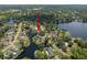 An aerial view of a waterfront property with lush greenery and connecting waterways at 18712 Lakeshore Dr, Lutz, FL 33549