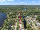 Overhead view of house on canal with lake view and beautiful landscaping at 18712 Lakeshore Dr, Lutz, FL 33549
