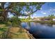 Scenic canal view from the backyard, showcasing lush greenery and waterfront tranquility at 18712 Lakeshore Dr, Lutz, FL 33549