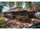 View of the back of the property, highlighting the home's backyard, porch, and landscaping at 18712 Lakeshore Dr, Lutz, FL 33549