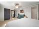 Bedroom featuring a large dresser, a mirror, and a doorway leading to another room at 18712 Lakeshore Dr, Lutz, FL 33549