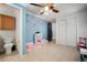 Playroom with painted walls, ceiling fan, carpet, closet, furniture, and attached bathroom at 18712 Lakeshore Dr, Lutz, FL 33549
