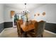 Elegant dining room with a large table, chandelier, and access to an outdoor area at 18712 Lakeshore Dr, Lutz, FL 33549
