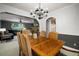 Elegant dining room with a large table, chandelier, and an archway to another room at 18712 Lakeshore Dr, Lutz, FL 33549