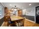 Updated kitchen featuring wood cabinets, granite countertops, stainless steel appliances, and breakfast bar at 18712 Lakeshore Dr, Lutz, FL 33549