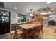 Updated kitchen features wood cabinets, granite countertops, stainless steel appliances, and large island at 18712 Lakeshore Dr, Lutz, FL 33549