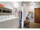 Bright laundry room with a washer, dryer, and closet space for organizing at 18712 Lakeshore Dr, Lutz, FL 33549