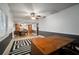 Bright living room featuring hardwood floors and a view into the dining room and kitchen at 18712 Lakeshore Dr, Lutz, FL 33549