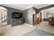 Cozy living room featuring a media center and decorative archway at 18712 Lakeshore Dr, Lutz, FL 33549