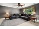 Comfortable living room featuring a large sectional sofa, and natural light at 18712 Lakeshore Dr, Lutz, FL 33549