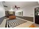 Office/den featuring custom bookshelves, ceiling fan, plush carpet and natural lighting at 18712 Lakeshore Dr, Lutz, FL 33549